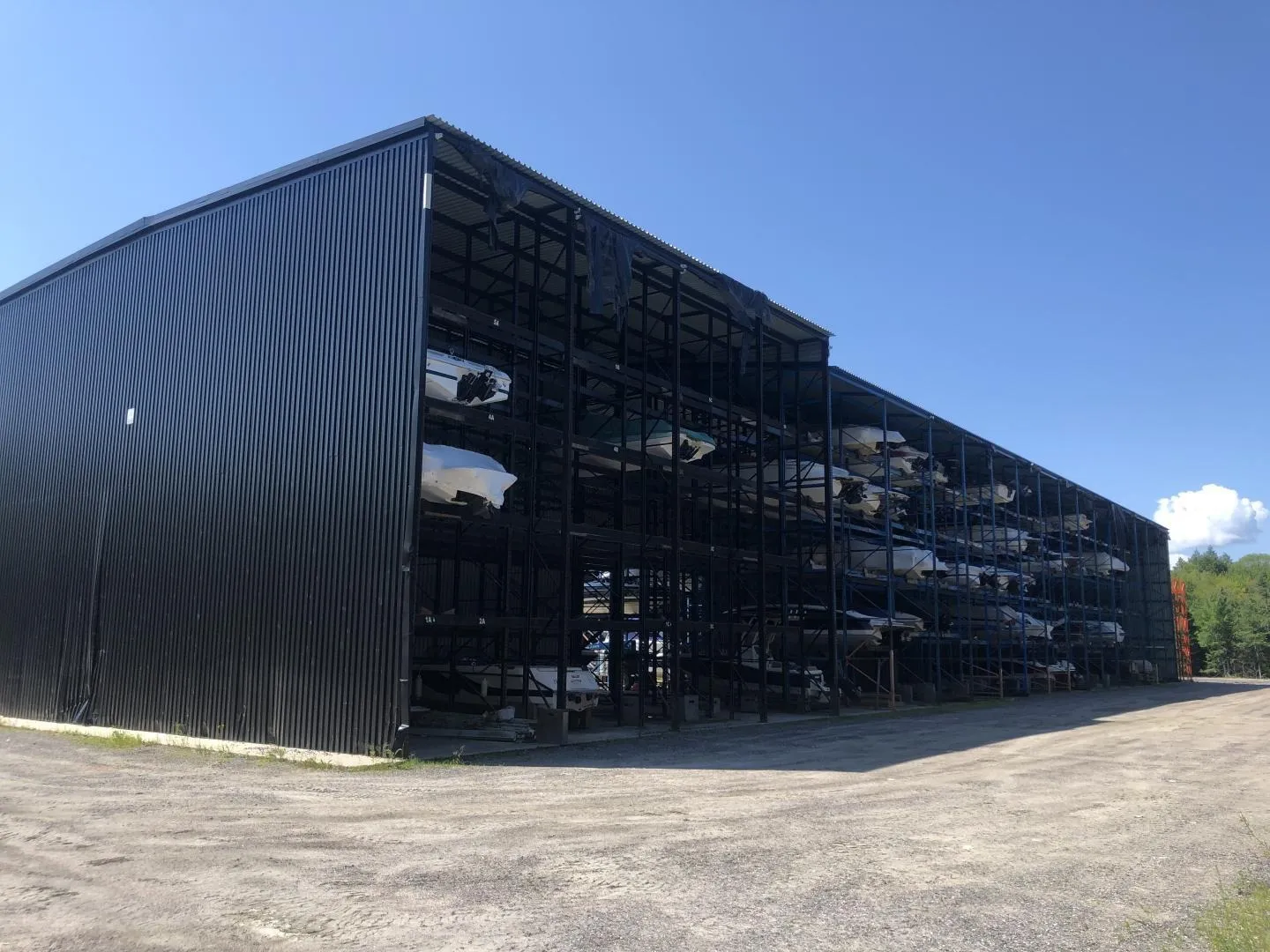 Pontoon boats stored safely at a secure marina and storage facility